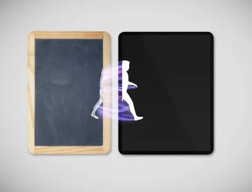 A person walking from a chalkboard into an electronic tablet.