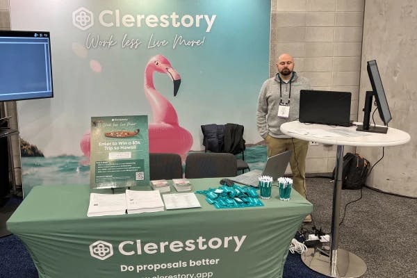 A photo of Clerestory members in front of their tradeshow booth.