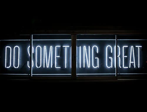 a neon sign that says do something great