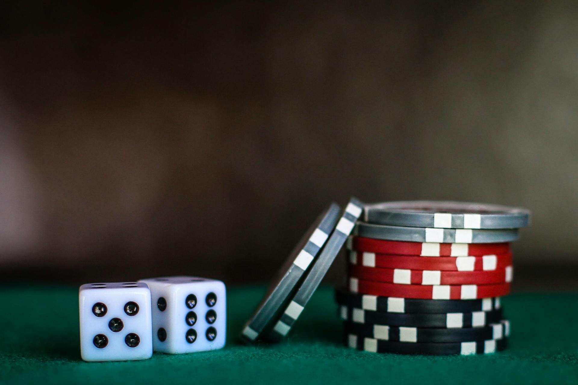 Poker chips and two dice on a poker table