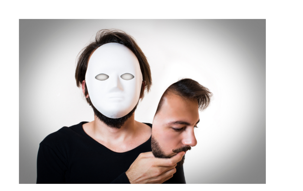 A man holding his face in his hand while his face is blank.