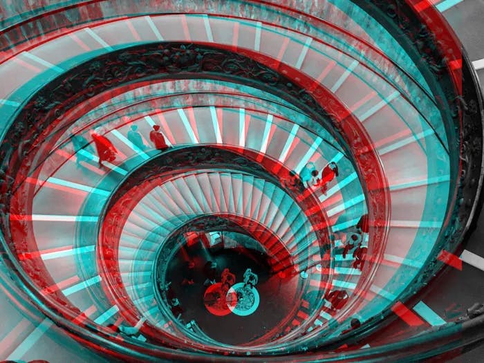 A spiral staircase with a red and blue 3d effect.