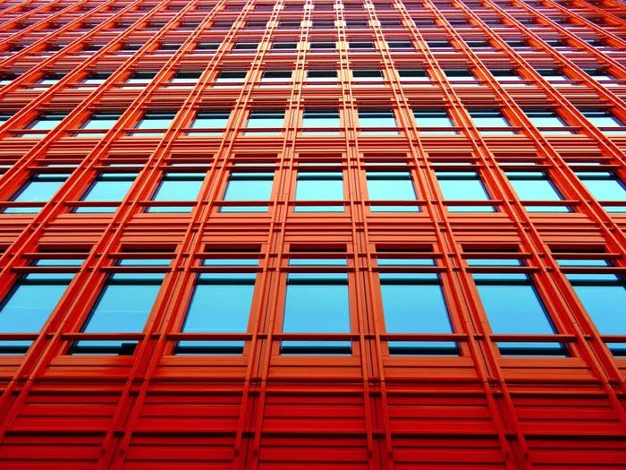 Multiple windows on an orange building