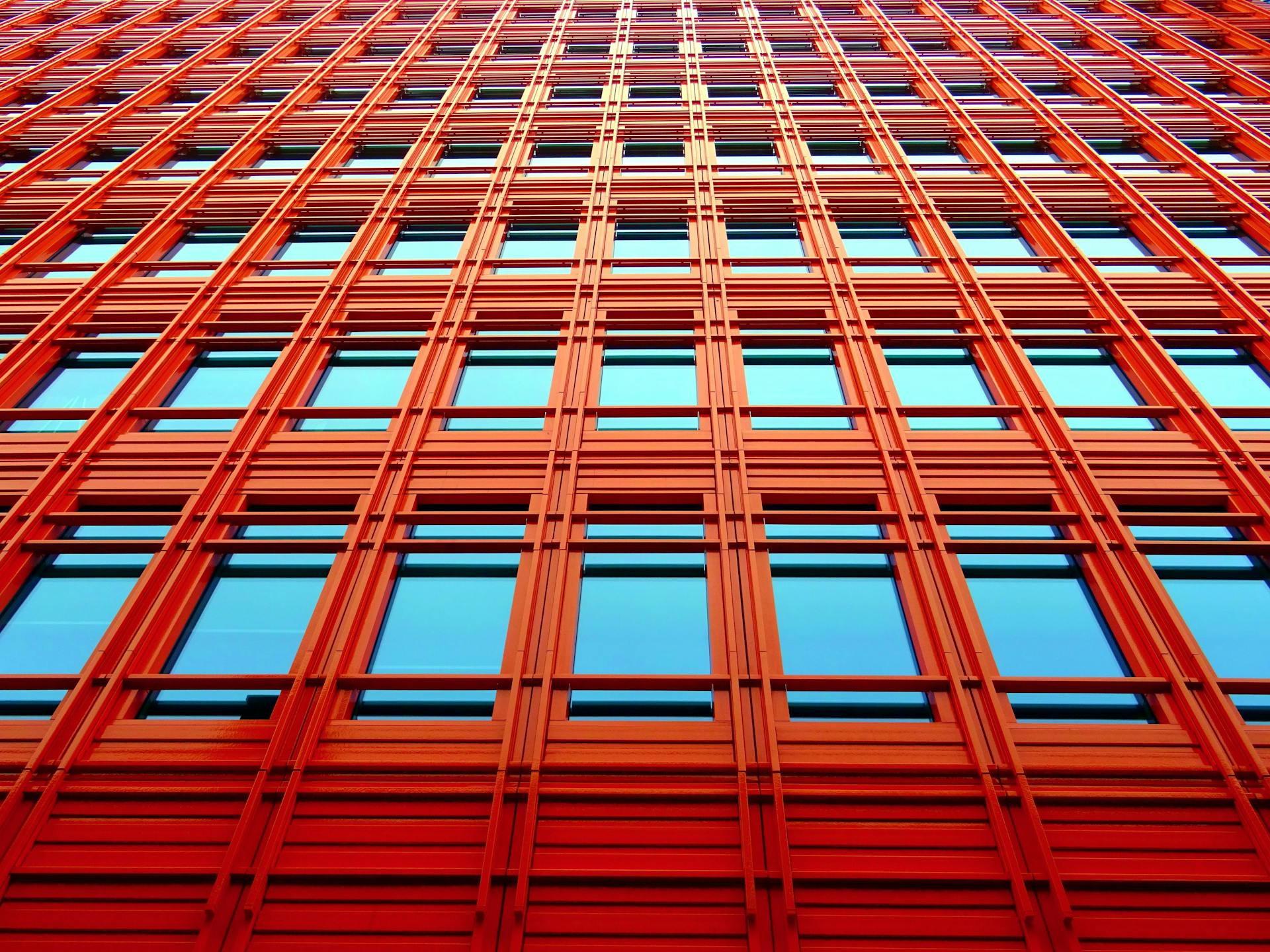 Multiple windows on an orange building