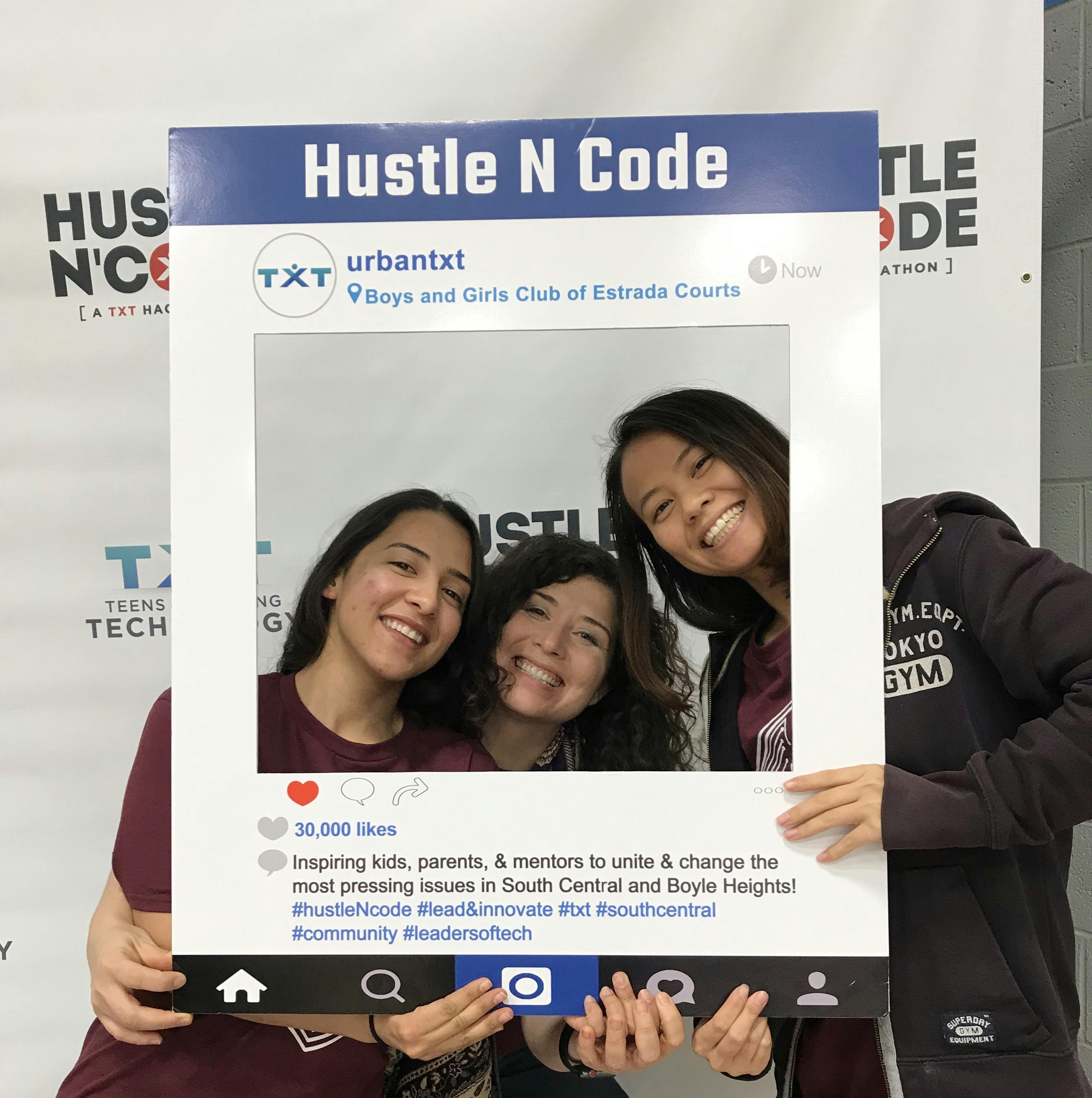 Three women posing at Hustle N' Code